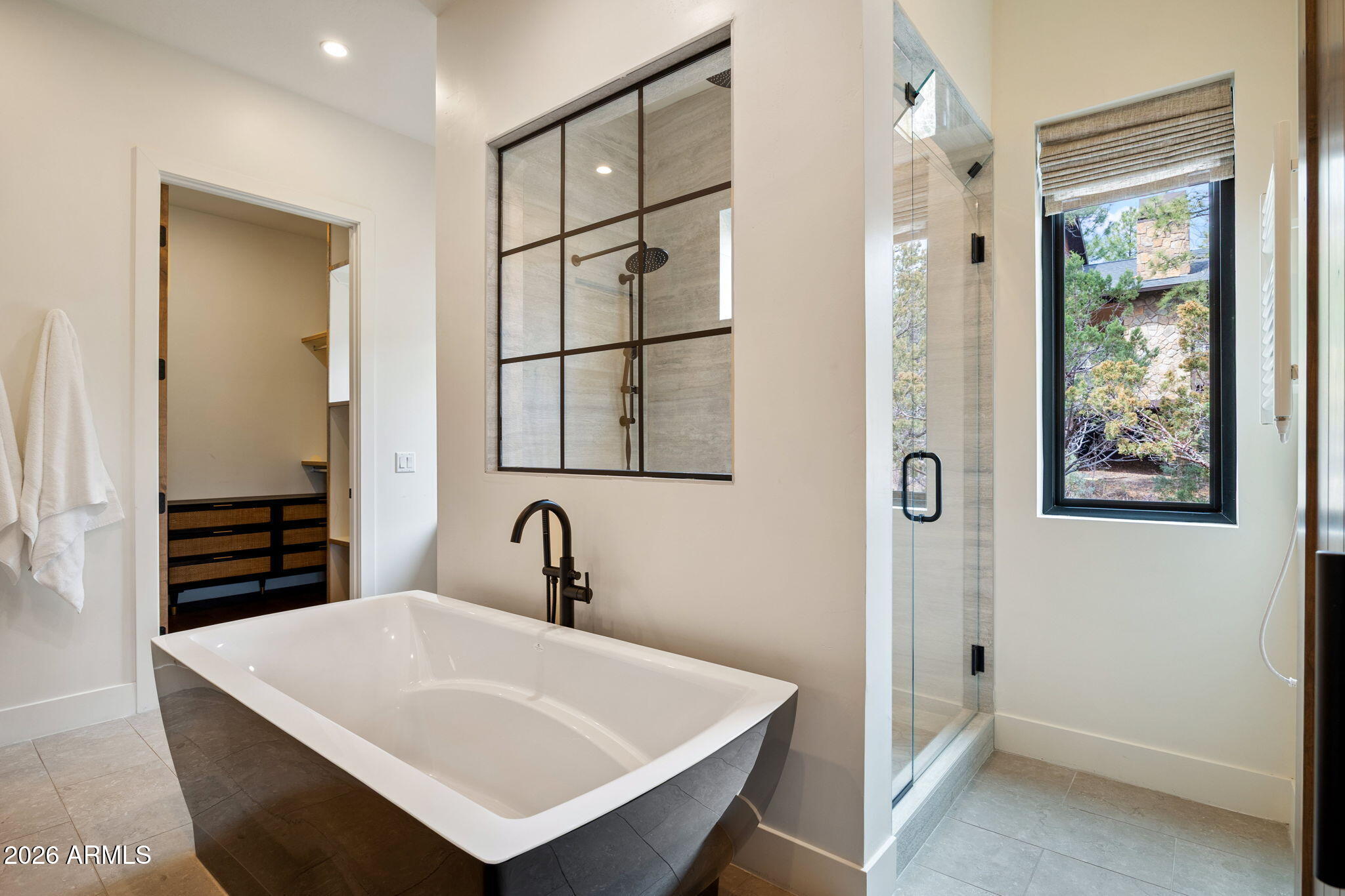 2441 South Monkshood Road Show Low, AZ 85901 - Photo 31 of 90 a white bath tub sitting next to a bathroom sink
