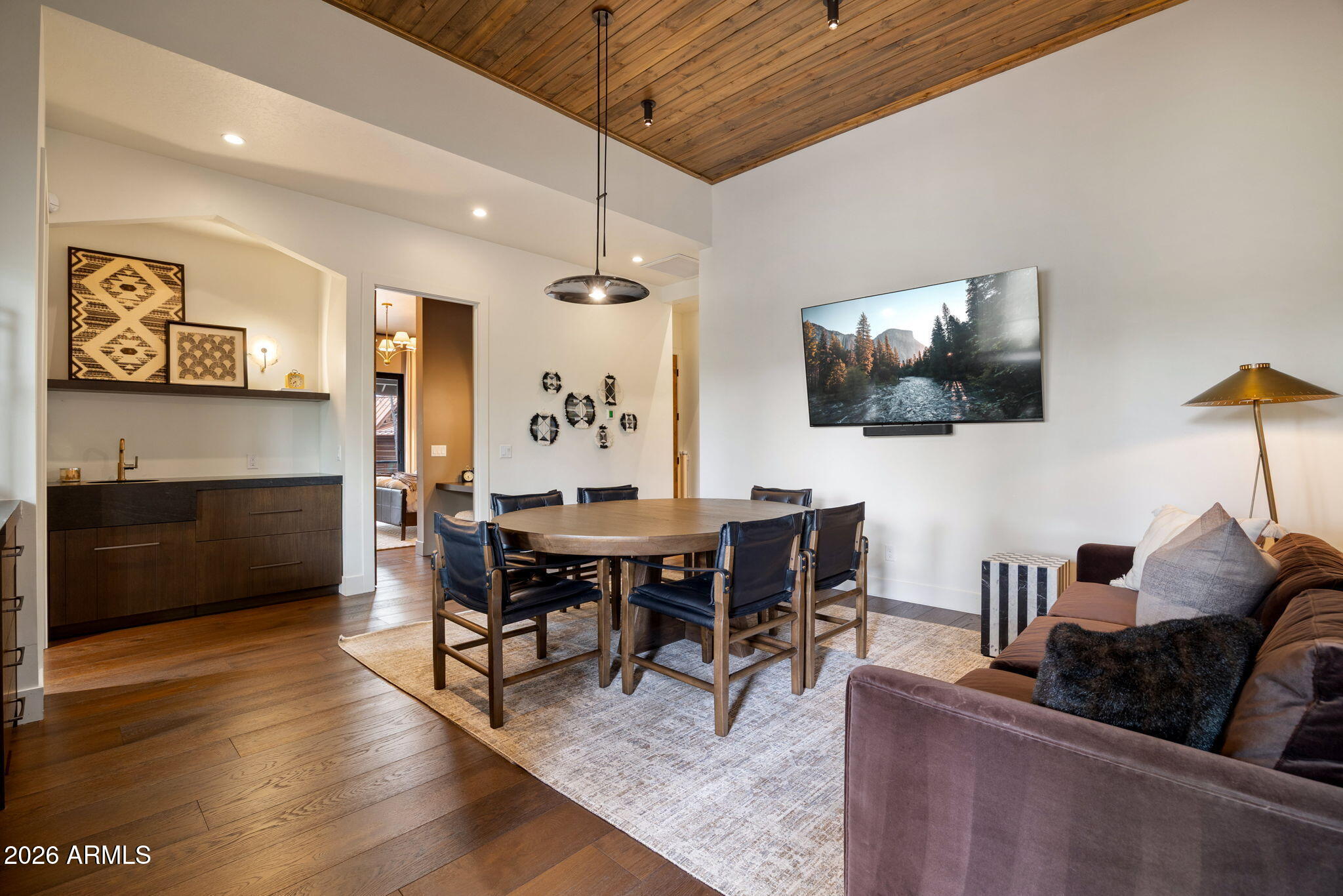 2441 South Monkshood Road Show Low, AZ 85901 - Photo 45 of 90 a view of a dining room with furniture and wooden floor
