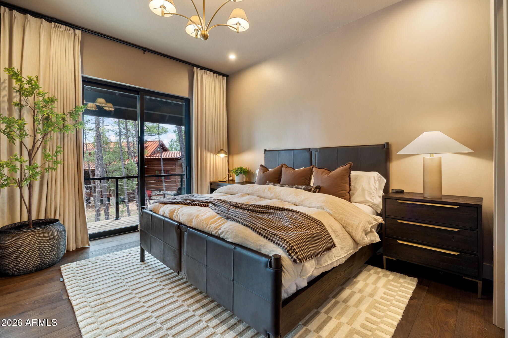 2441 South Monkshood Road Show Low, AZ 85901 - Photo 49 of 90 a large bed sitting in a bedroom next to a window