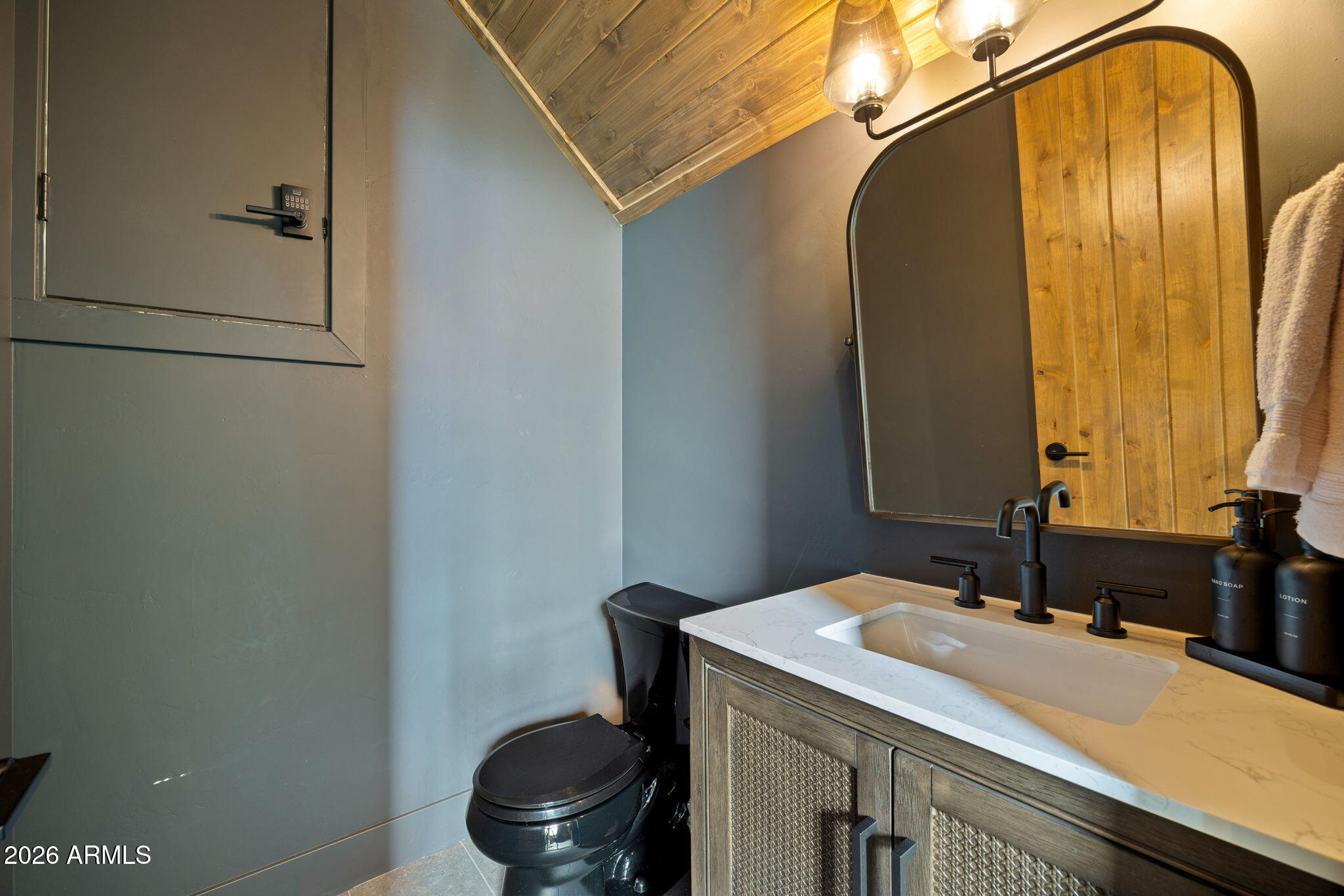 2441 South Monkshood Road Show Low, AZ 85901 - Photo 67 of 90 a bathroom with a granite countertop sink and a mirror