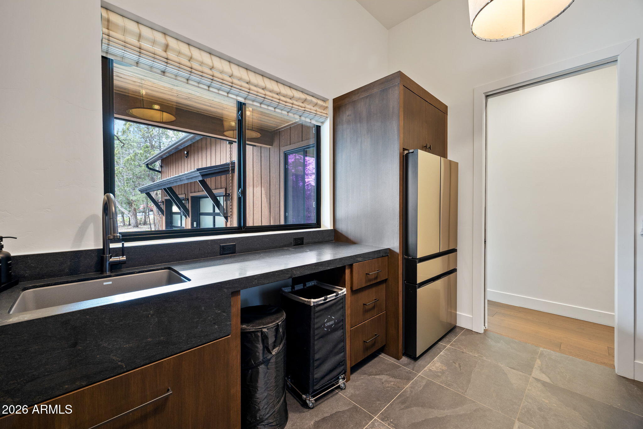 2441 South Monkshood Road Show Low, AZ 85901 - Photo 70 of 90 a kitchen with stainless steel appliances a sink and a refrigerator
