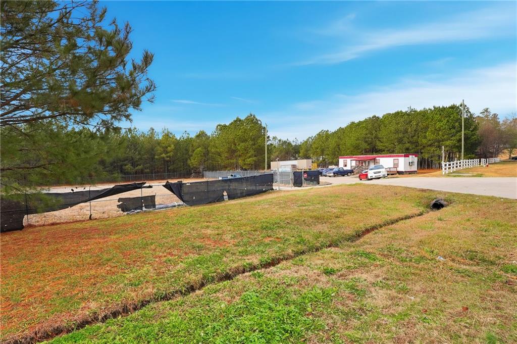 1052 Carl-Bethlehem Road Winder, GA 30680 - Photo 15 of 15 a view of swimming pool with a yard