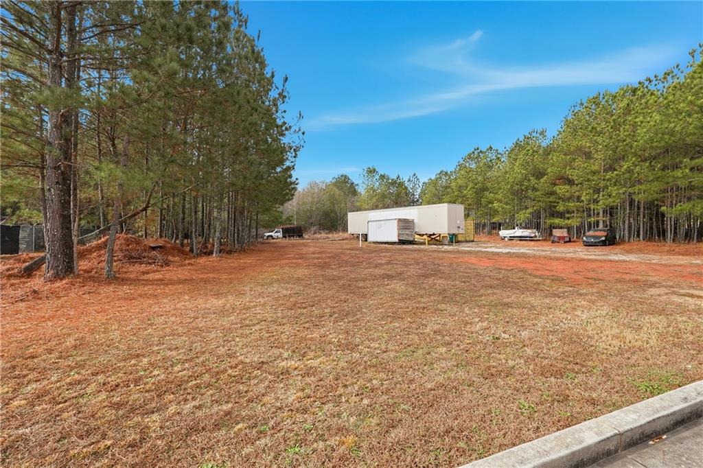 1052 Carl-Bethlehem Road Winder, GA 30680 - Photo 15 of 20 a view of road with large trees