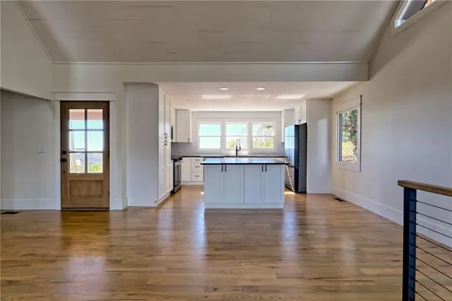 a view of an entryway with wooden floor
