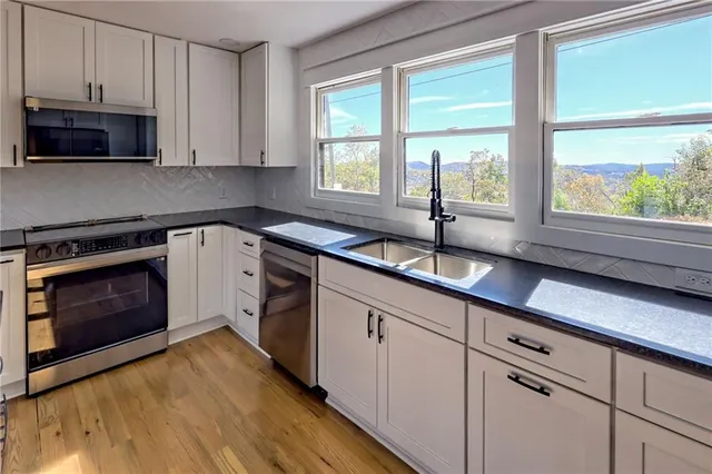 a bathroom with a sink toilet a shower and a bathtub