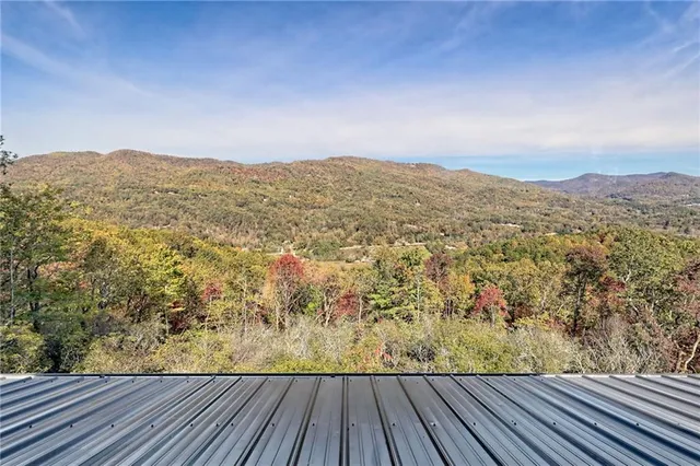 a bathroom with a toilet a sink a vanity and mirror