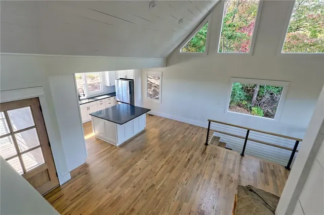 a bathroom with a shower sink and mirror