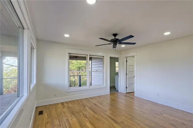 a view of a room with window and wooden floor