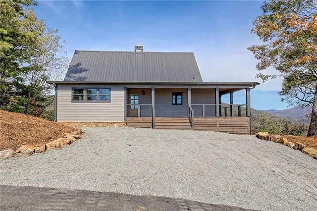 a kitchen with granite countertop a sink stove and refrigerator