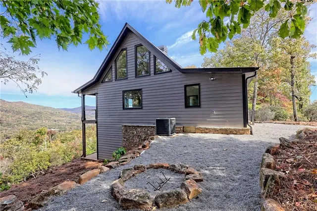a kitchen with kitchen island granite countertop a stove a sink and a granite counter tops