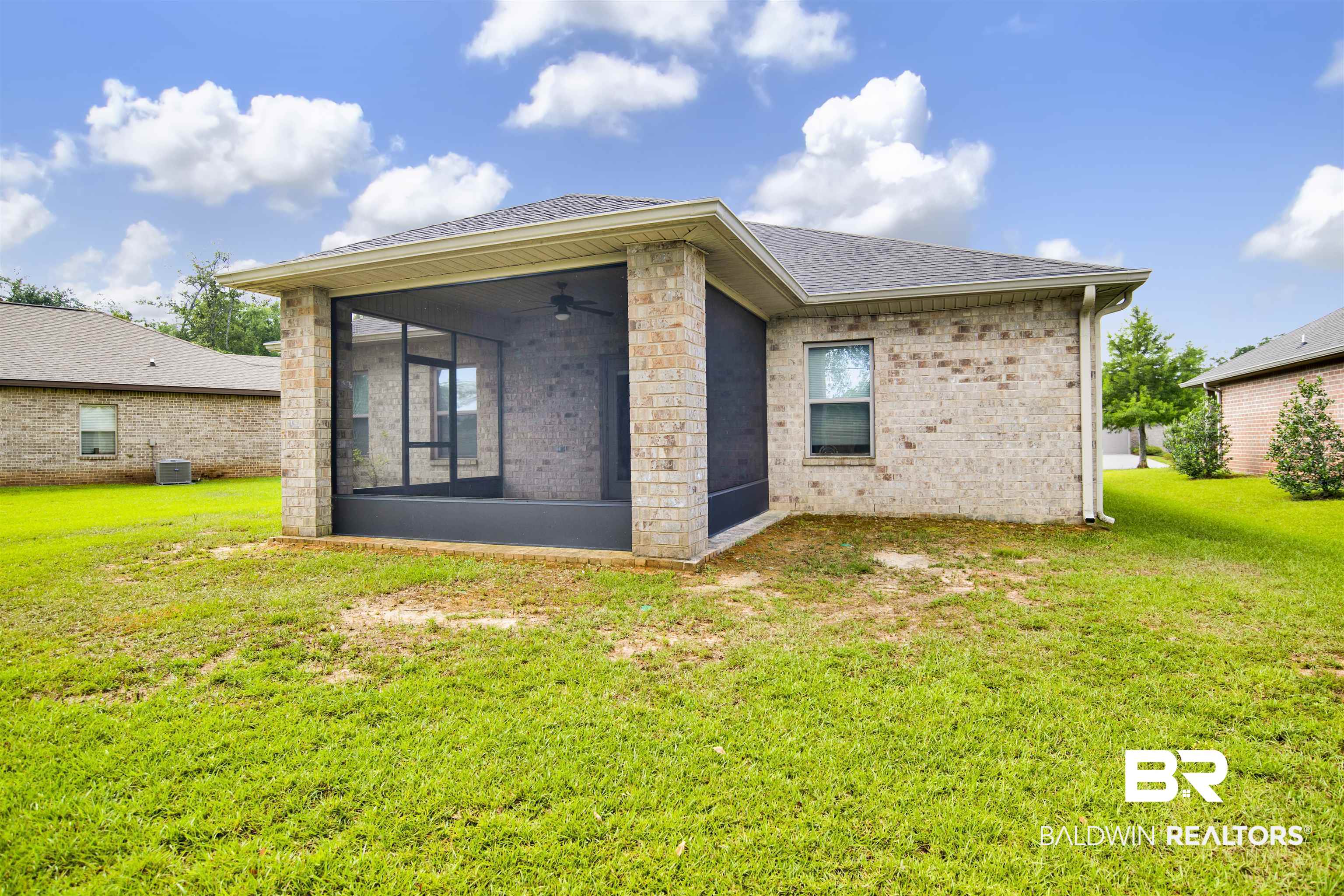 1468 Surrey Loop Foley, AL 36535 - Photo 27 of 28 Back of house with a sunroom, roof with shingles, a yard, and ceiling fan