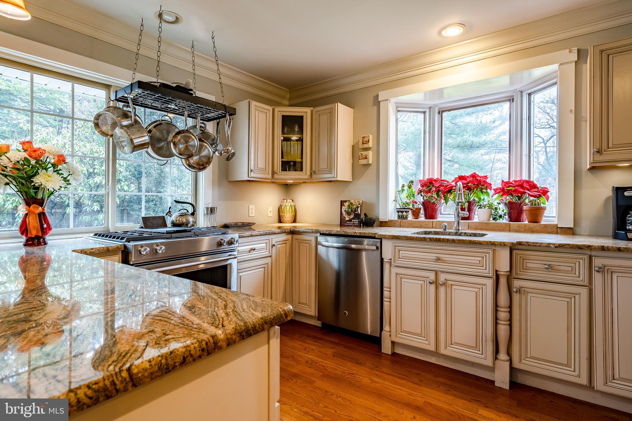 104 Arlington Road Paoli, PA 19301 - Photo 18 of 49 Cream cabinets with granite counters