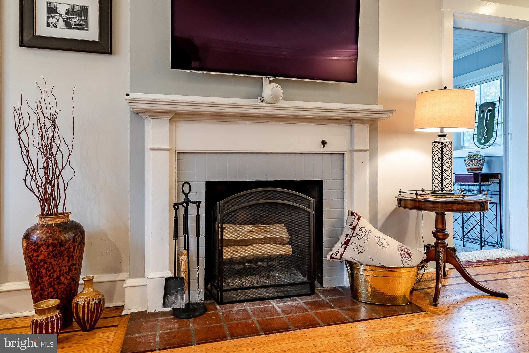 104 Arlington Road Paoli, PA 19301 - Photo 10 of 49 Wood burning fireplace with tv above