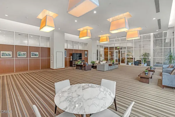 a view of a living room and kitchen