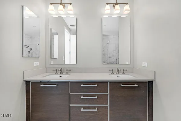 a bathroom with a bathtub and a shower