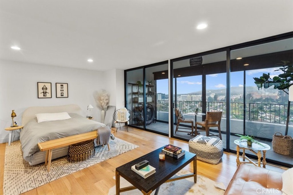 10501 Wilshire Boulevard, Unit 2212 Los Angeles, CA 90024 - Photo 13 of 25 a living room with furniture and a floor to ceiling window