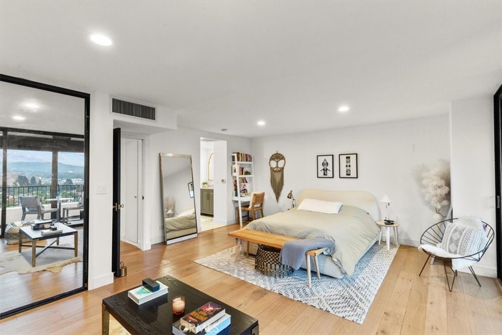 10501 Wilshire Boulevard, Unit 2212 Los Angeles, CA 90024 - Photo 14 of 25 a living room with furniture and a table