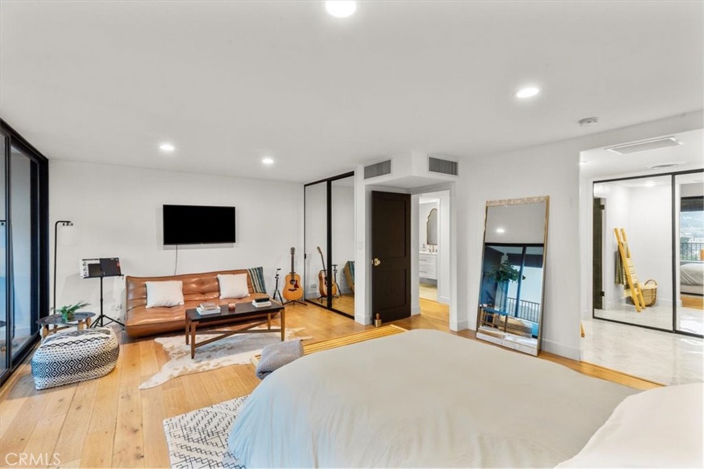 10501 Wilshire Boulevard, Unit 2212 Los Angeles, CA 90024 - Photo 15 of 25 a living room with furniture and a flat screen tv