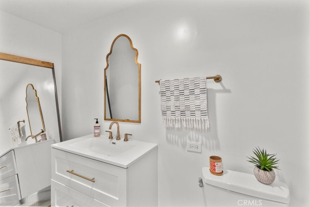 10501 Wilshire Boulevard, Unit 2212 Los Angeles, CA 90024 - Photo 18 of 25 a bathroom with a sink and a mirror