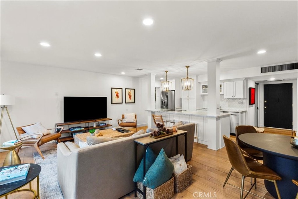 10501 Wilshire Boulevard, Unit 2212 Los Angeles, CA 90024 - Photo 6 of 25 a kitchen with stainless steel appliances kitchen island granite countertop a sink and cabinets
