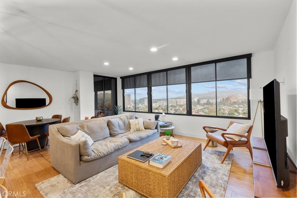 10501 Wilshire Boulevard, Unit 2212 Los Angeles, CA 90024 - Photo 10 of 25 a living room with furniture and a large window