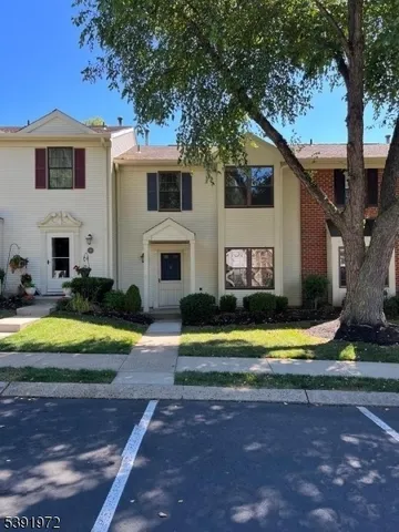 a view of a house with swimming pool and a yard