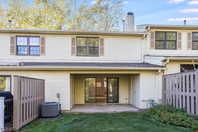 a view of a house with a yard and plants