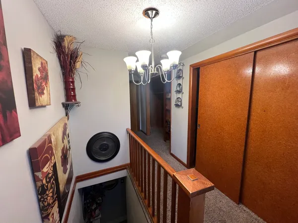 a view of a hallway with washer and dryer