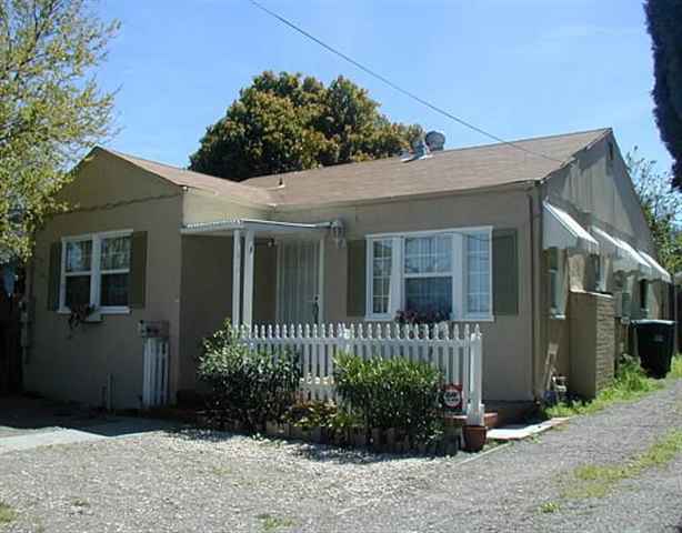 1331 East Leland Road Pittsburg, CA 94565 - Photo 1 of 1 a front view of a house with garden