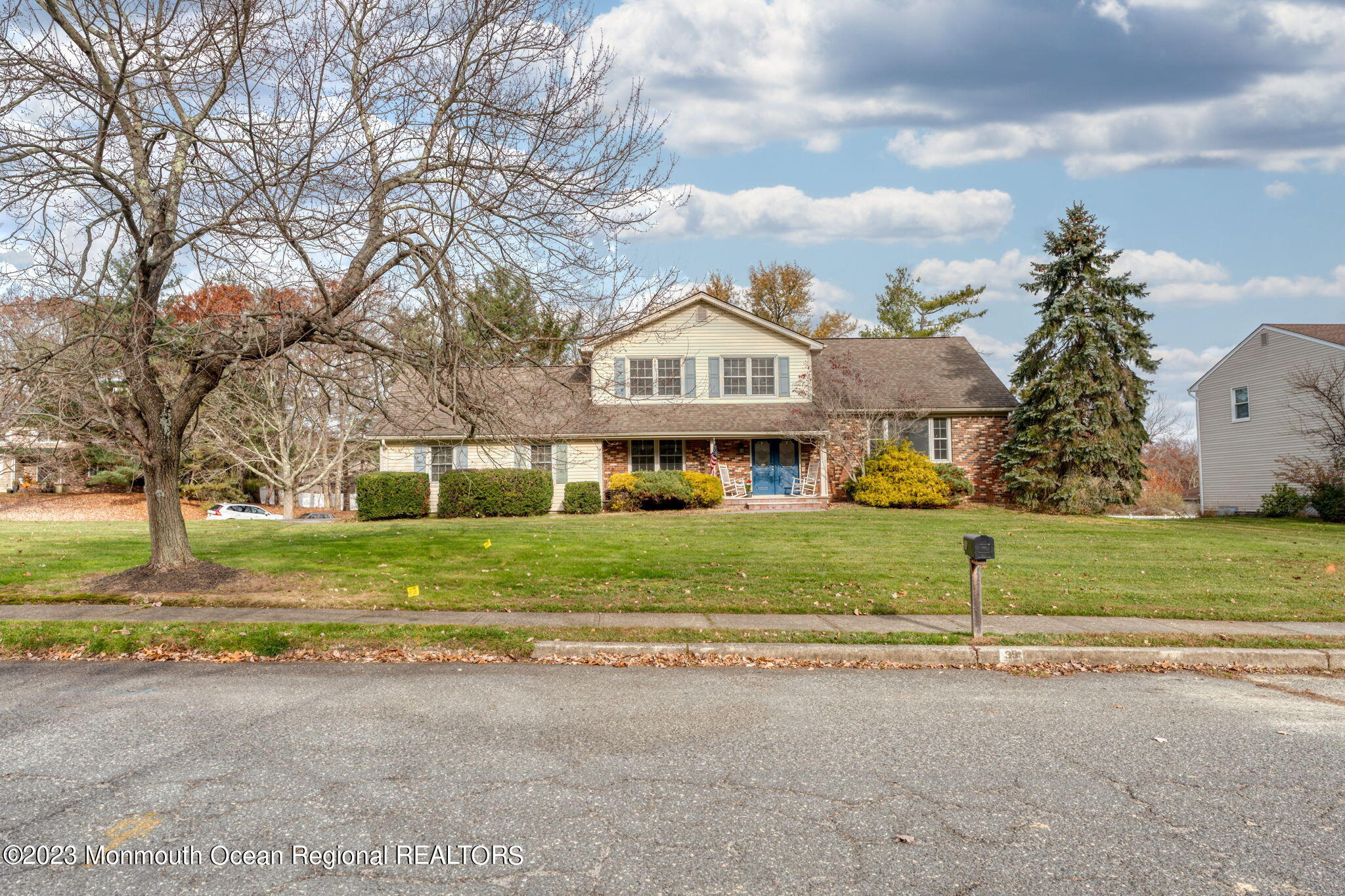a front view of house with yard and green space