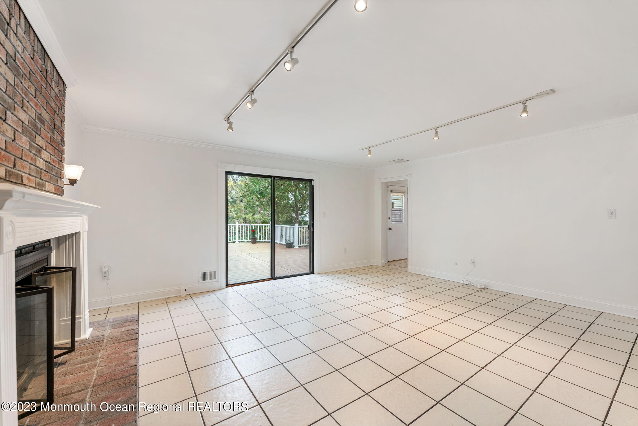 35 Lambert Johnson Drive Asbury Park, NJ 07712 - Photo 11 of 34 a view of an empty room with a fireplace