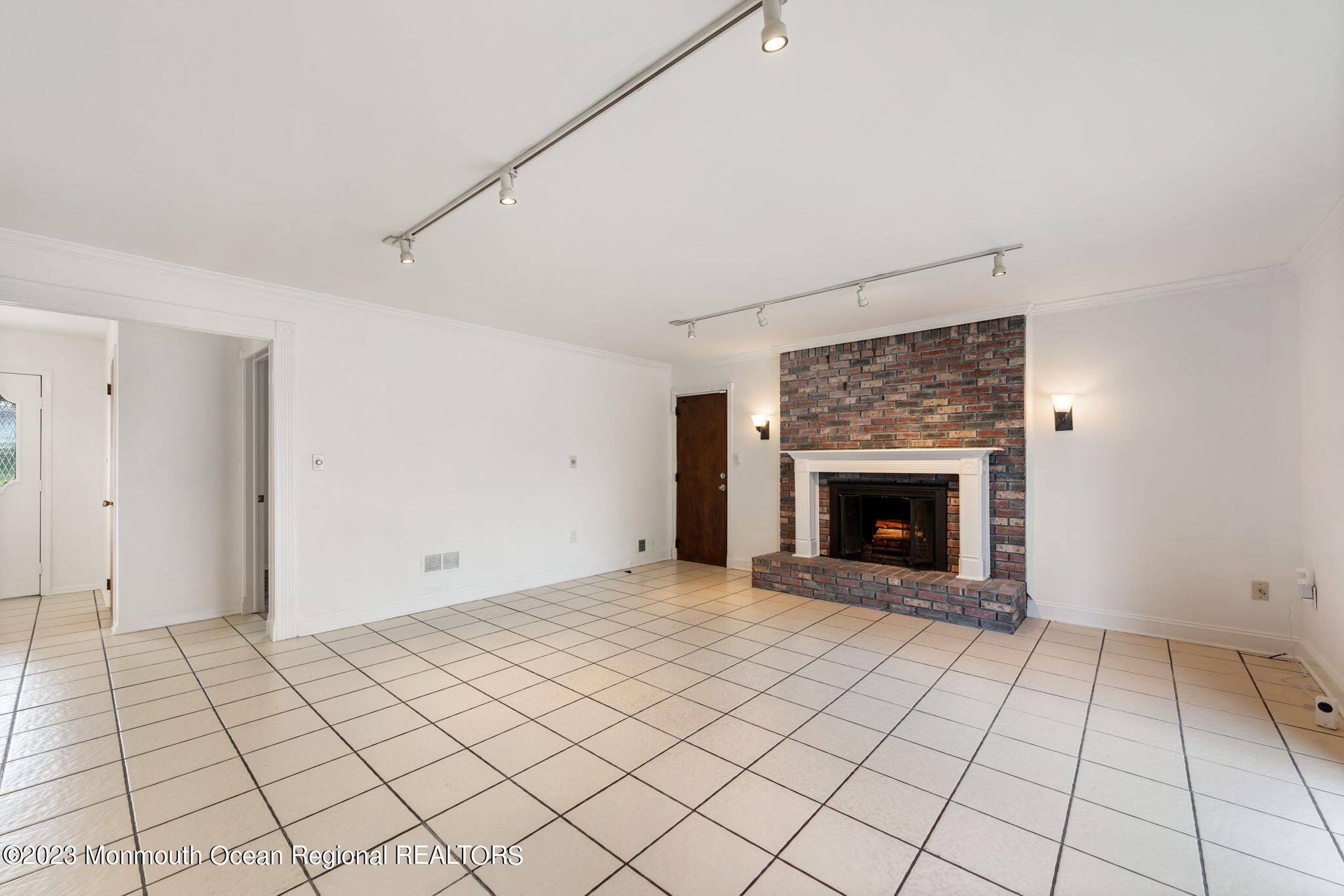 35 Lambert Johnson Drive Asbury Park, NJ 07712 - Photo 12 of 34 a view of an empty room with a fireplace