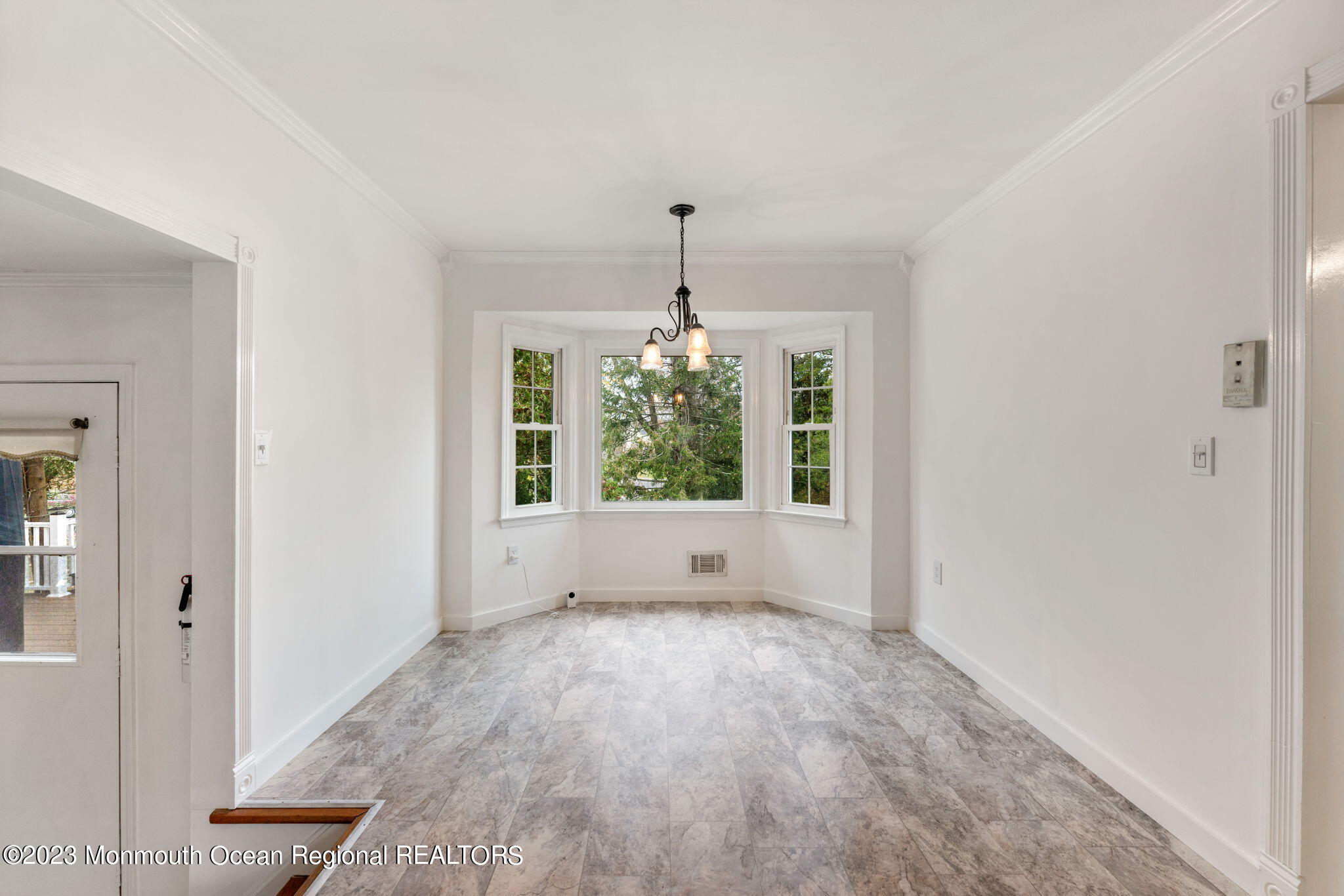 35 Lambert Johnson Drive Asbury Park, NJ 07712 - Photo 17 of 34 wooden floor in an empty room with a window