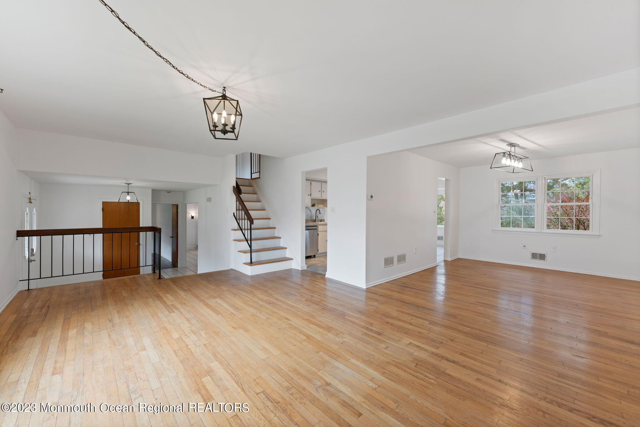 35 Lambert Johnson Drive Asbury Park, NJ 07712 - Photo 19 of 34 an empty room with wooden floor and windows