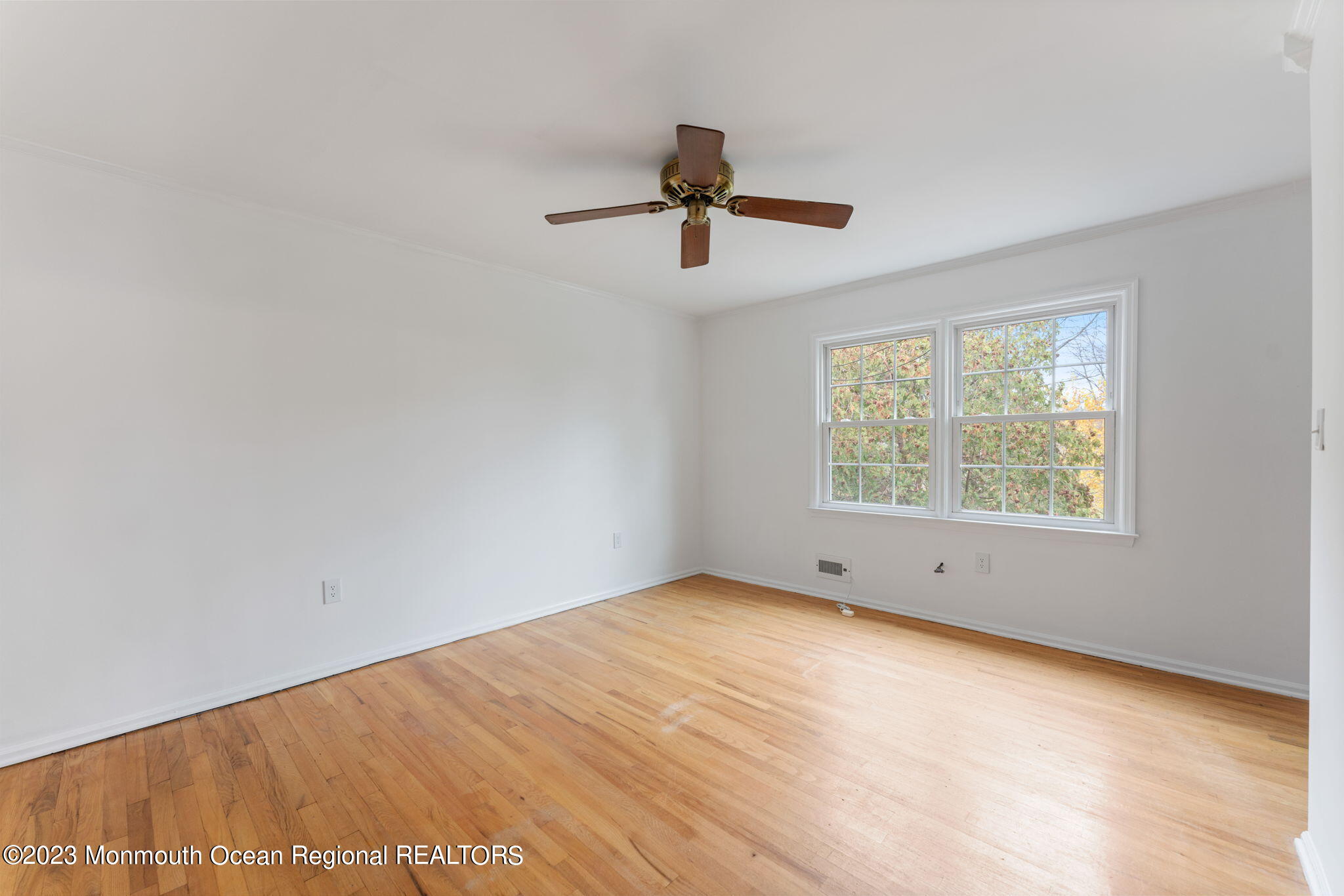 35 Lambert Johnson Drive Asbury Park, NJ 07712 - Photo 28 of 34 a view of an empty room with a window