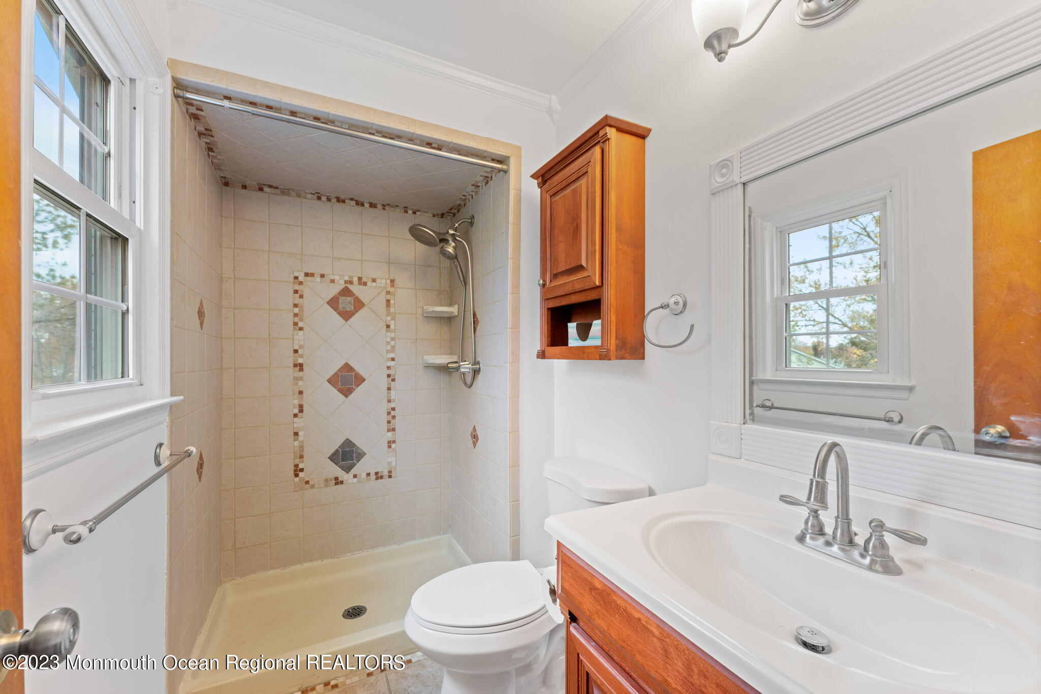 35 Lambert Johnson Drive Asbury Park, NJ 07712 - Photo 31 of 34 a bathroom with a sink toilet and shower