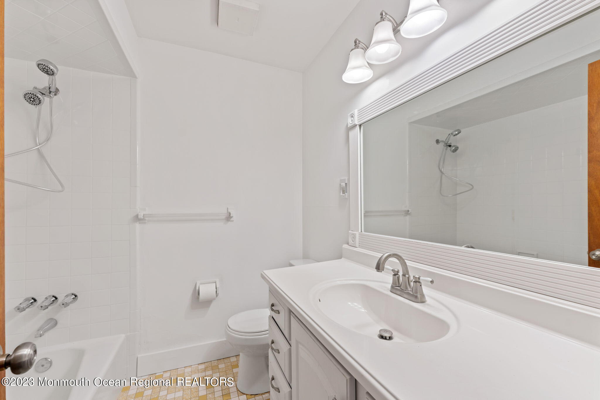 35 Lambert Johnson Drive Asbury Park, NJ 07712 - Photo 32 of 34 a bathroom with a sink a toilet and shower