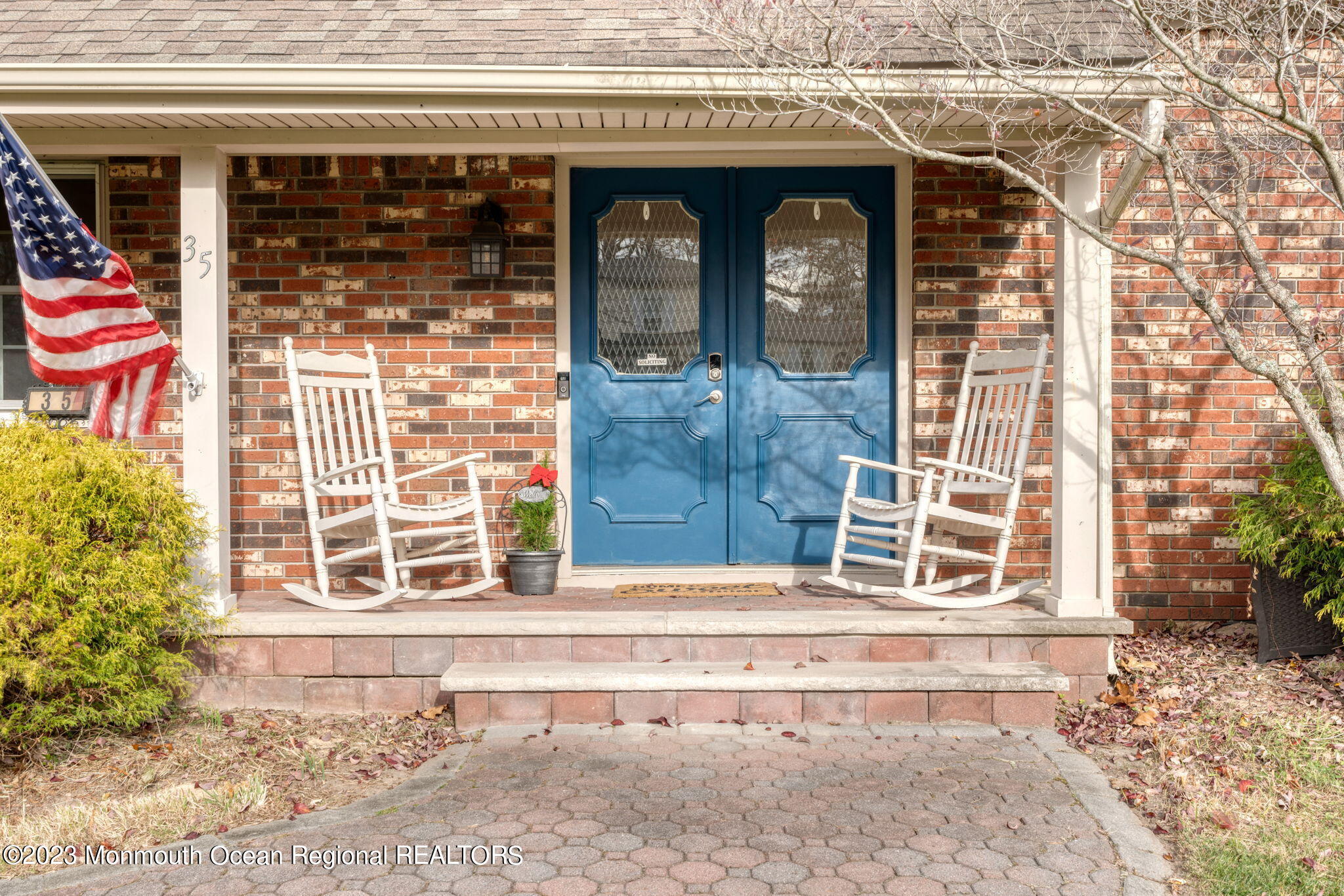 35 Lambert Johnson Drive Asbury Park, NJ 07712 - Photo 4 of 34 a front view of a house with glass windows and door