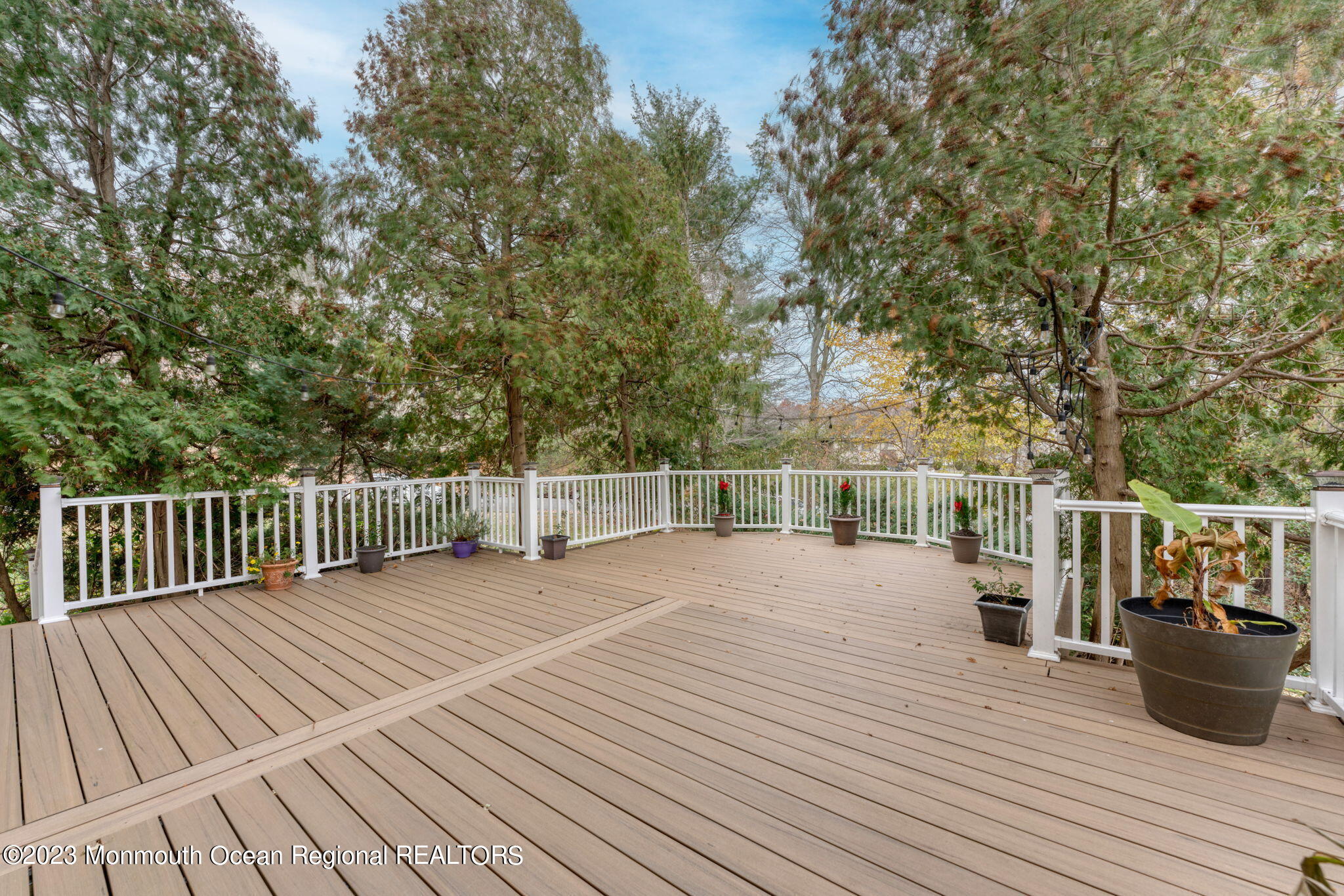 35 Lambert Johnson Drive Asbury Park, NJ 07712 - Photo 8 of 34 a view of a balcony with wooden floor and fence