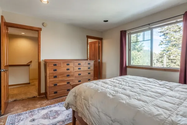 a bedroom with a bed and a closet