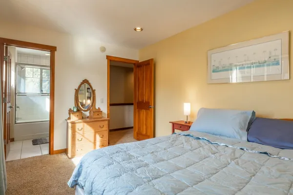 a bathroom with a sink a toilet and a shower