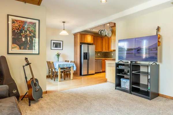 a view of a livingroom with furniture and a flat screen tv