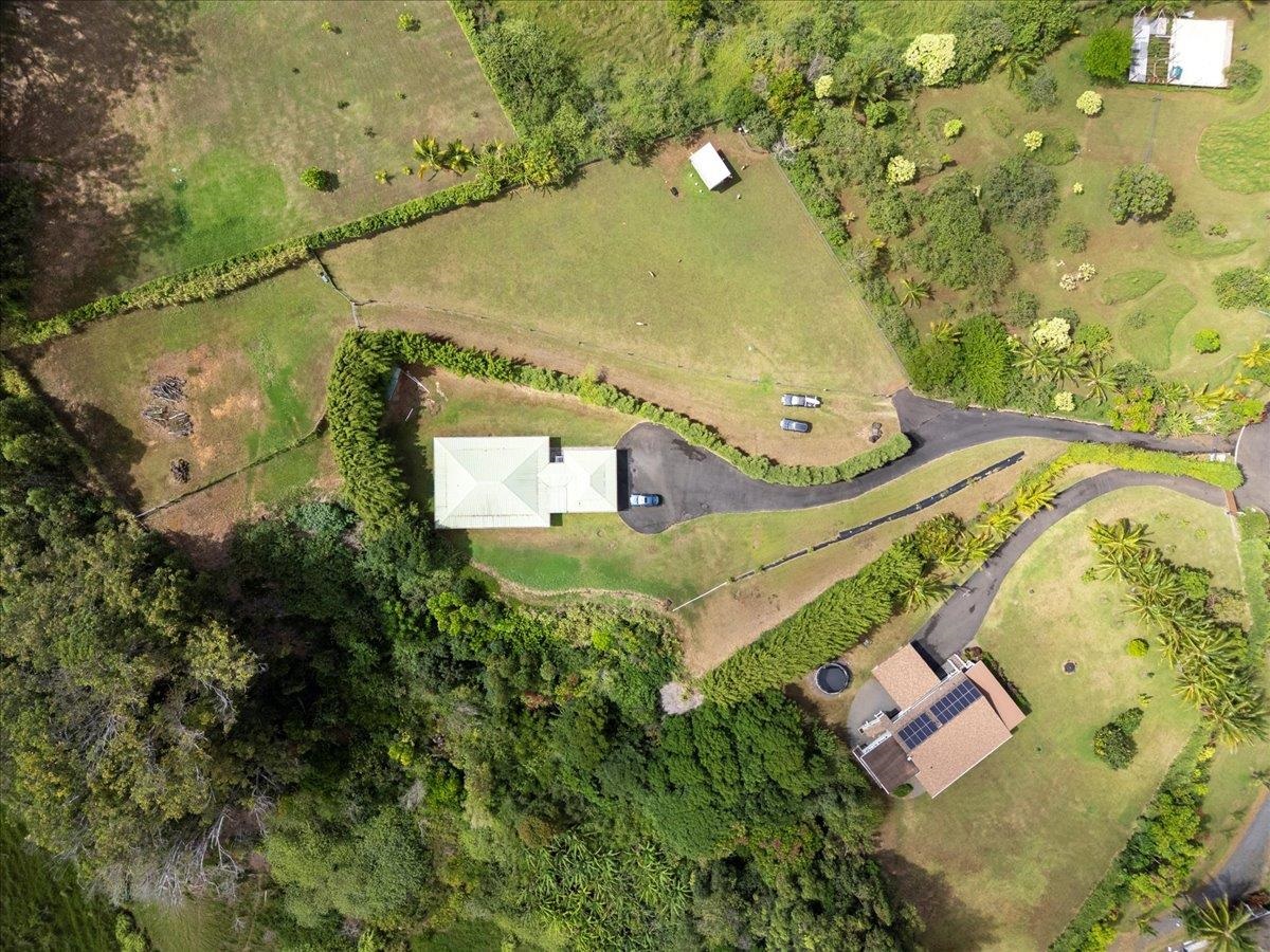 57 Awalau Road, Unit A Haiku, HI 96708 - Photo 19 of 22 an aerial view of a house with a yard