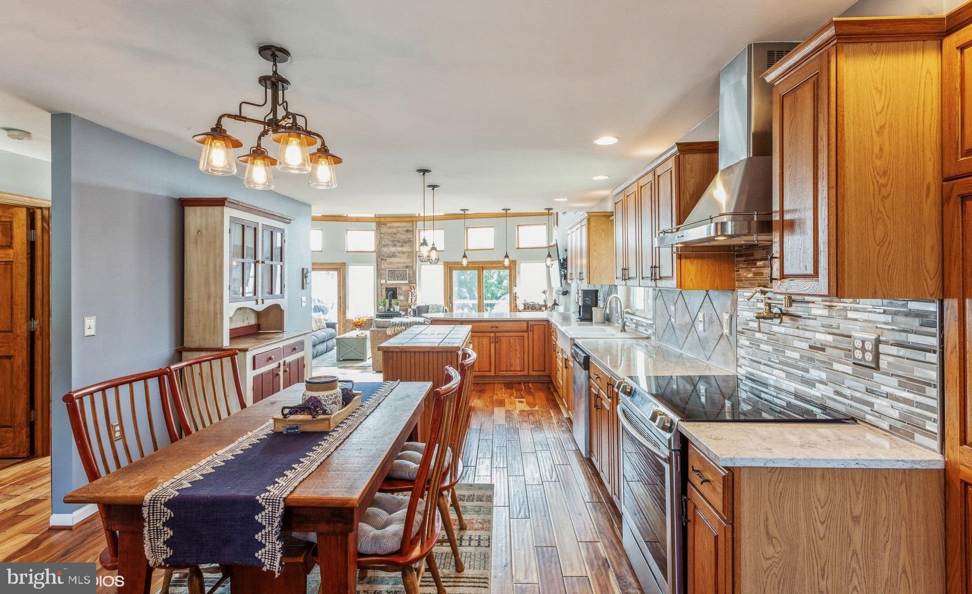 2425 Golupski Road Essex, MD 21221 - Photo 8 of 48 a very nice looking dining room with wooden floor and furniture