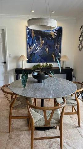 a dining room with furniture and a fireplace