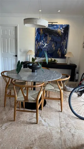 a room with a table and chairs