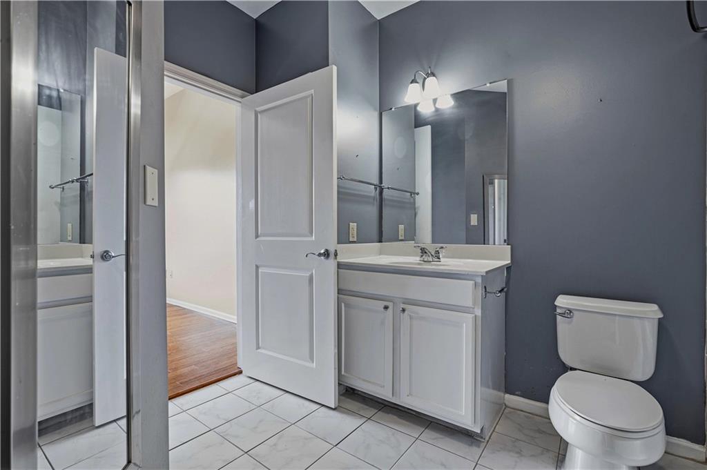 3040 Peachtree Road Northwest, Unit 1503 Atlanta, GA 30305 - Photo 22 of 38 a bathroom with a toilet sink and shower