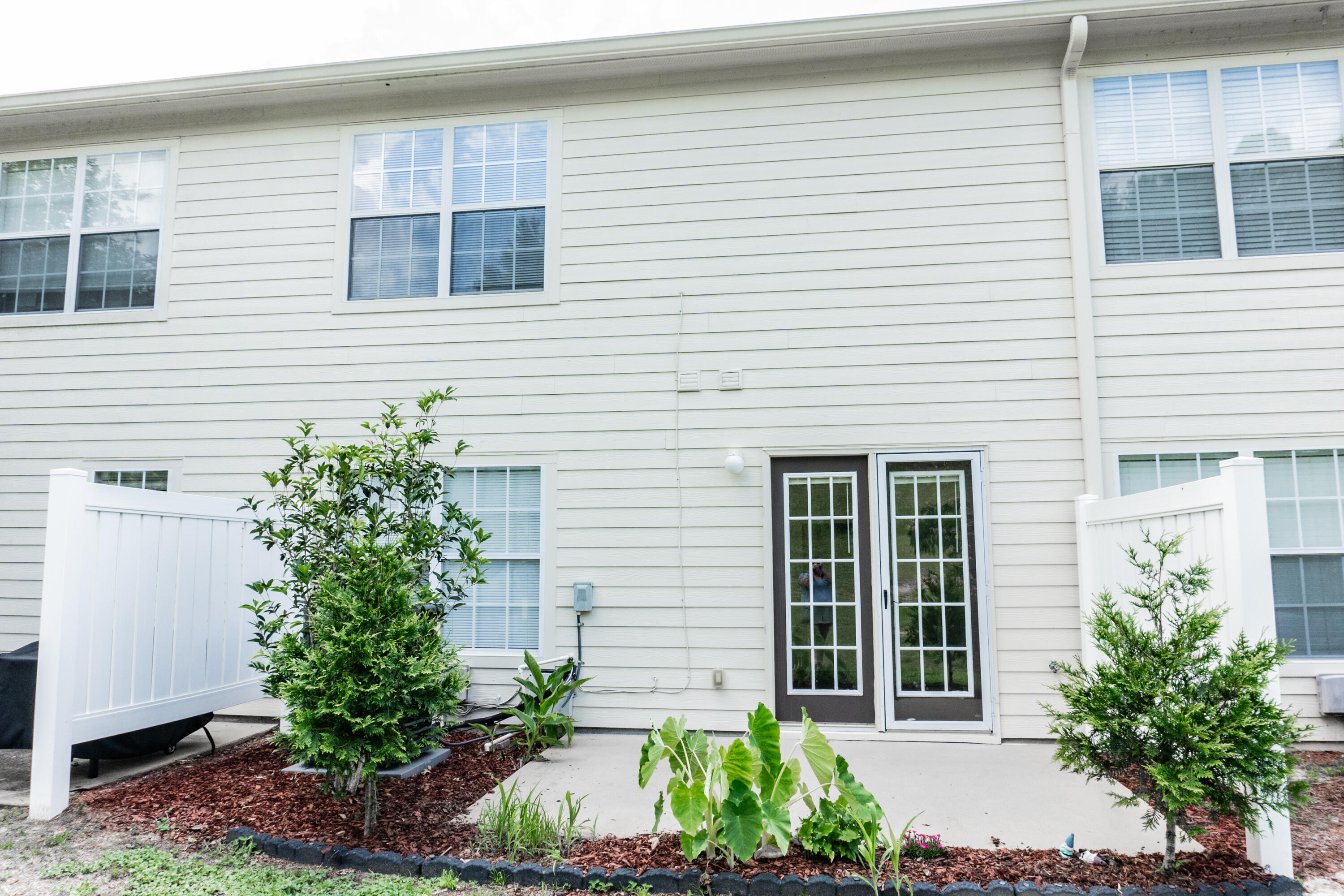 560 Wingspan Way Crestview, FL 32536 - Photo 14 of 18 a potted plant sitting in front of a house