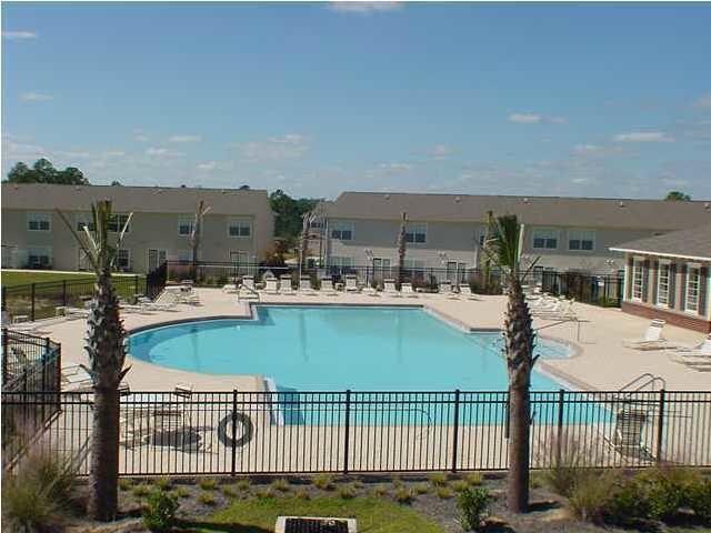 560 Wingspan Way Crestview, FL 32536 - Photo 18 of 18 a view of a lake and a terrace