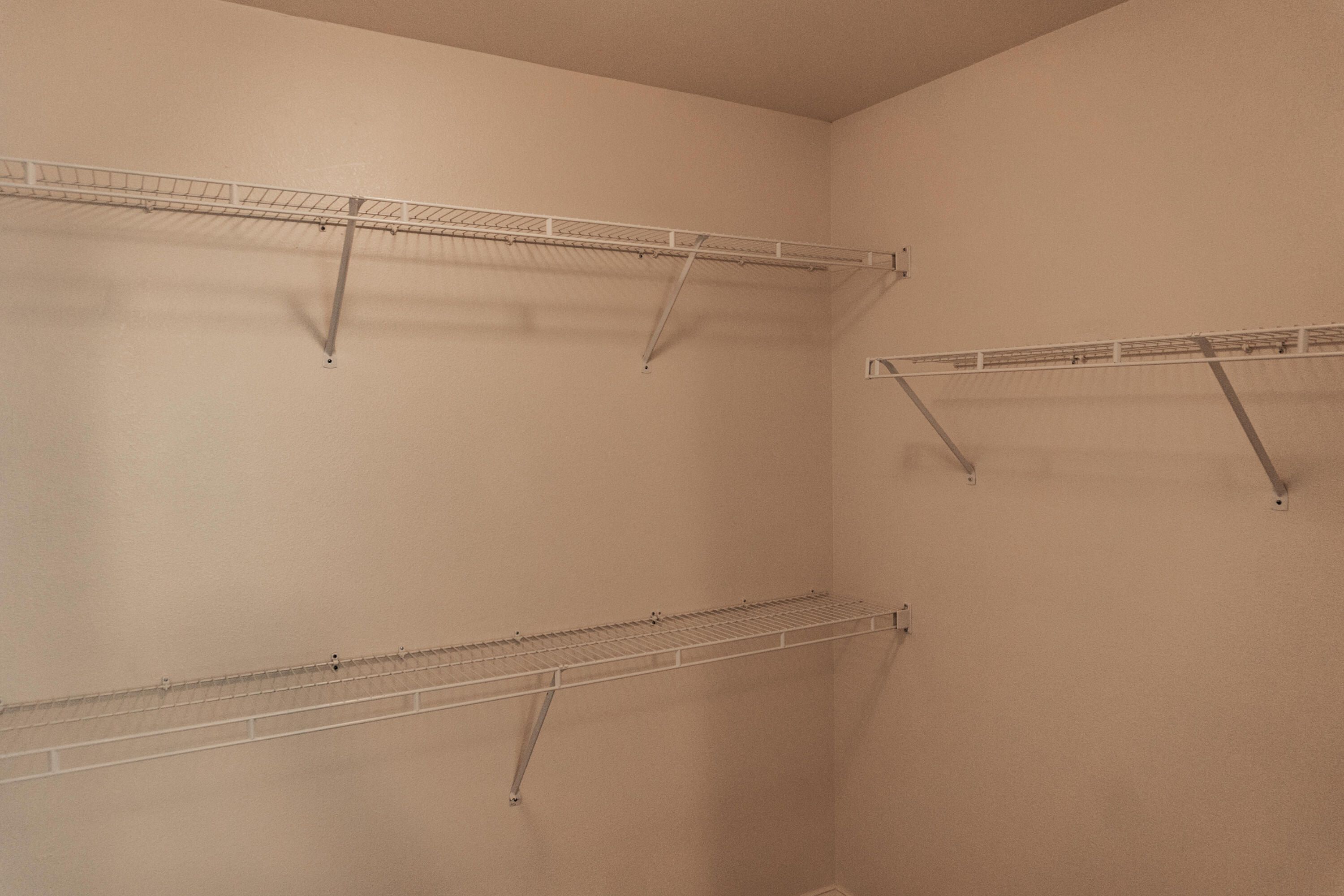 560 Wingspan Way Crestview, FL 32536 - Photo 9 of 18 a view of a room with racks on the wall